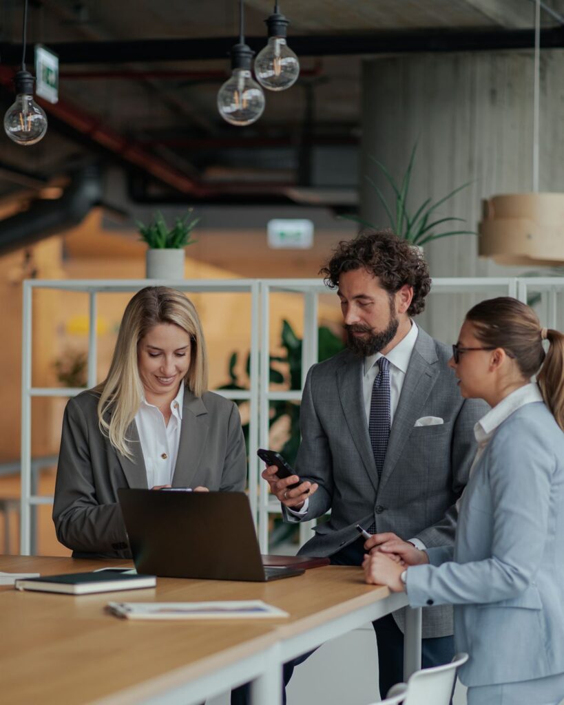 Professional team reviewing work together in a modern office