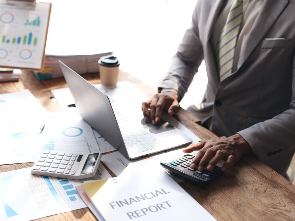 Financial services professional reviewing reports